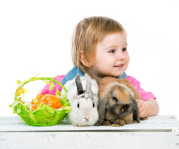 baby with rabbits - Foto, imagen