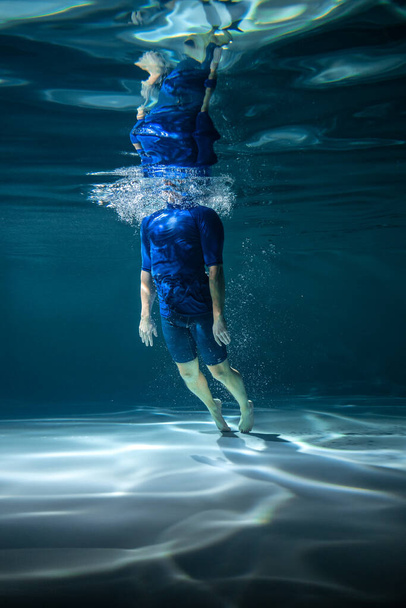 Swimmer Under Water in the Pool. Copy Space. Sports Concept - Fotó, kép