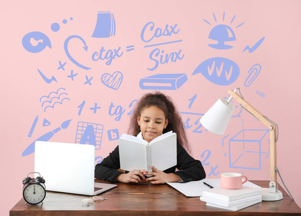 Little African-American girl doing homework at home - Photo, image