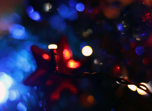 Christmas bokeh. Abstract holiday defocused background. Blurred lights on the Christmas tree - Photo, Image