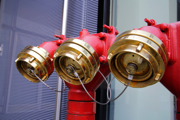 002 Shiny metal red water plug with seals and plugs on the street, Красный блестящий металлический пожарный кран  с пломбами и затычками на улице - Photo, Image