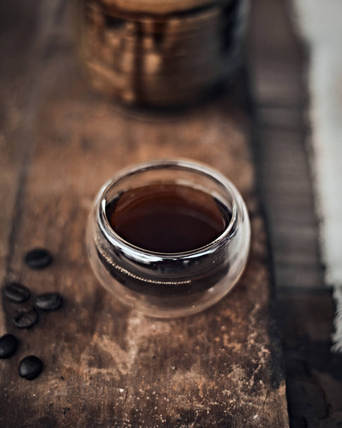 black drip coffee in glass cup - Фото, изображение