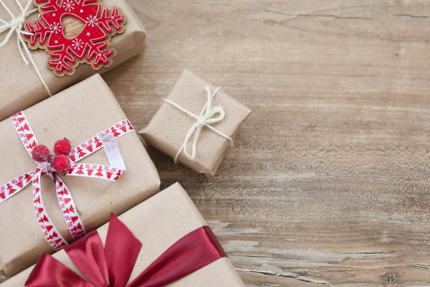 Christmas gift boxes on wooden background. New Year presents. - 写真・画像