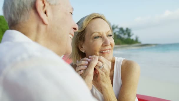 Healthy senior Caucasian couple relaxing outdoors Caribbean sunset - Footage, Video