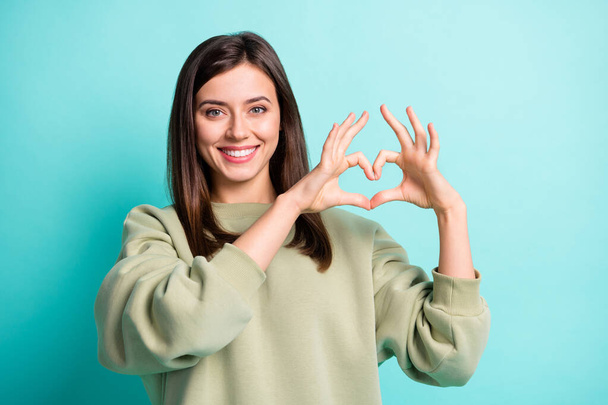 Photo portrait of positive woman making heart with fingers isolated on vivid cyan colored background - Φωτογραφία, εικόνα