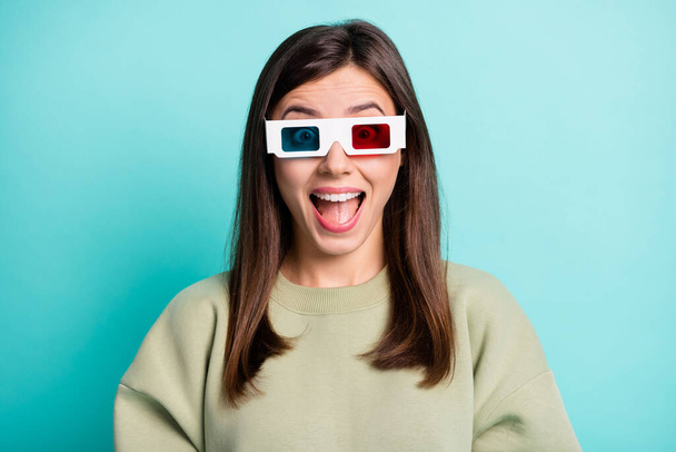 Photo portrait of cheerful girl screaming wearing 3d glasses isolated on vivid turquoise colored background - Foto, Bild