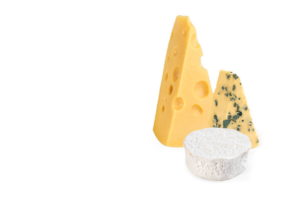 Maasdam, brie, blue cheese. three pieces of different cheese isolated on a white background - Foto, imagen