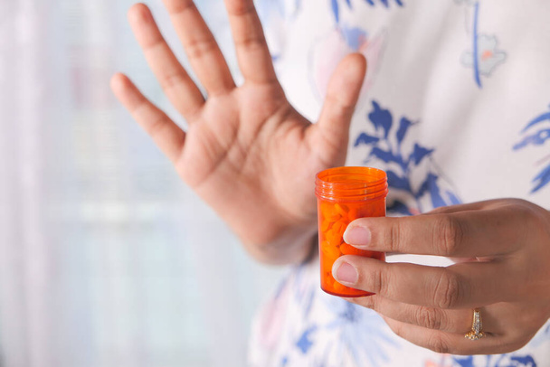  women hand holding pill container  - 写真・画像