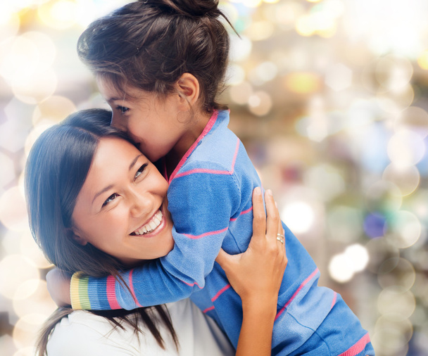 Hugging mother and daughter - 写真・画像