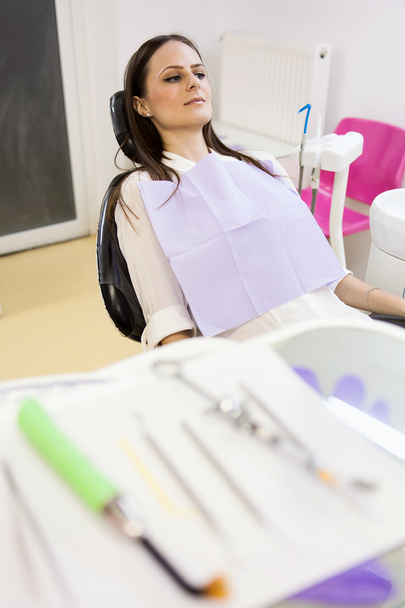  Woman patient at the dentist with instruments in the blurred fo - Fotó, kép