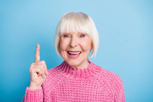 Photo portrait of happy old lady having idea raising finger up isolated on pastel blue colored background - Photo, Image