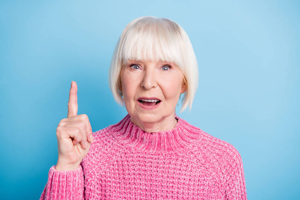 Photo portrait of confused old lady raising finger up isolated on pastel blue colored background - Fotoğraf, Görsel
