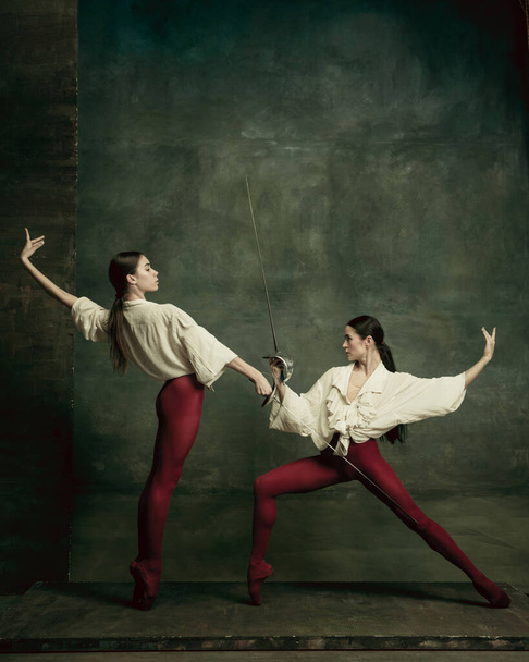 Two young female ballet dancers like duelists with swords. Ballet and contemporary choreography concept. Creative art photo. - Foto, Bild