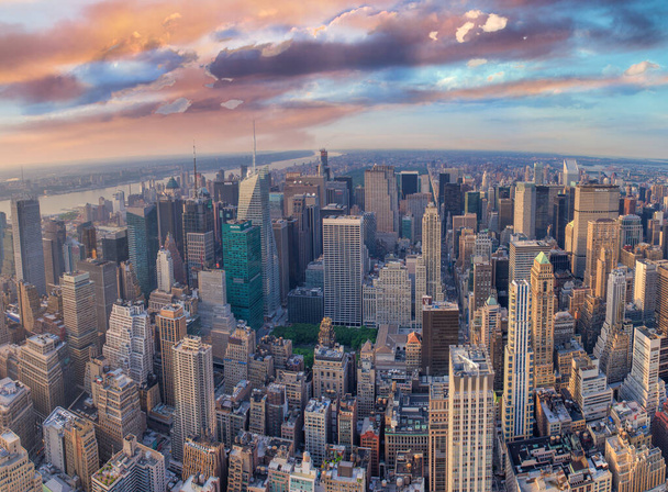 NEW YORK CITY - JUNE 10, 2013: Panoramic aerial view of Manhattan from a city rooftop at sunset. - Photo, Image