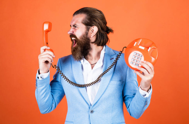mature bearded male guy looking elegant hold retro phone, technology - Foto, afbeelding