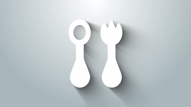 White Baby plastic cutlery with fork and spoon icon isolated on grey background. Cutlery for kid. Childrens dining items. 4K Video motion graphic animation - Footage, Video