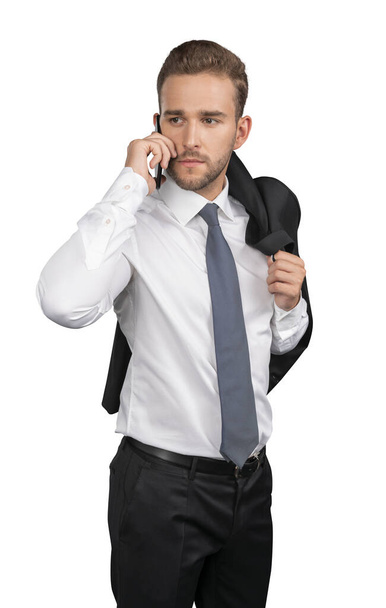 Businessman in shirt and tie with phone isolated over white background - Fotó, kép