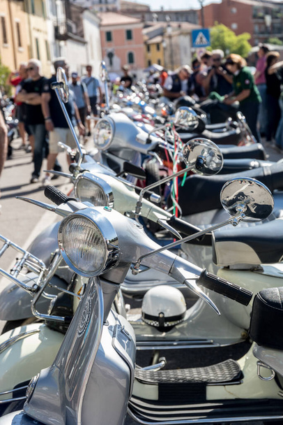PESCANTINA, VERONA, ITALY, JUNE 23, 2019: national gathering of the Vespa motorcycle, Vintage scooters, a nostalgic journey - Фото, изображение
