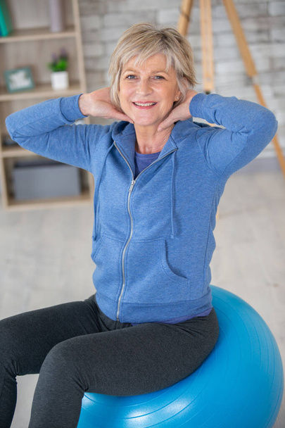 aged blond woman on fitness ball - Foto, Imagem