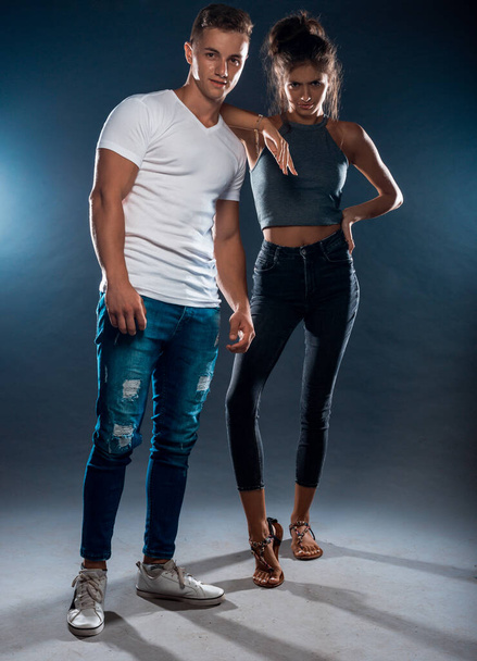 Body shot of attractive male and female models posing in modern clothes - Photo, Image