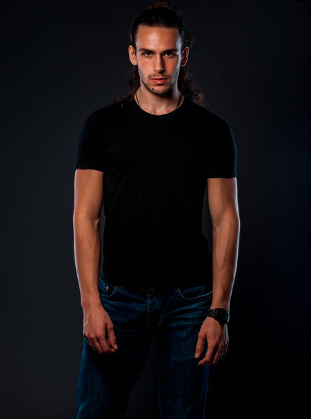 Studio body shot of a trendy young man wearing modern style clothes - Photo, Image
