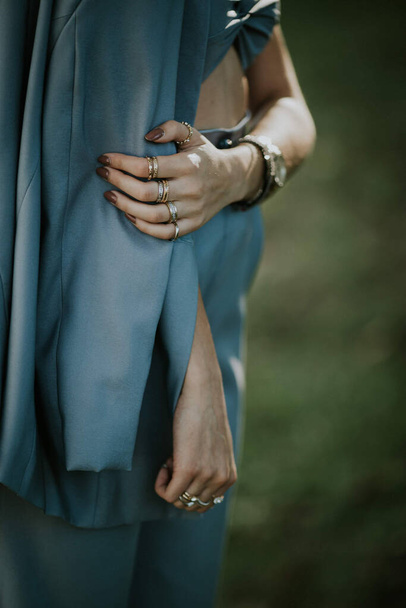 A selective focus shot of a young female hand wearing stylish jewelryrings - Foto, afbeelding
