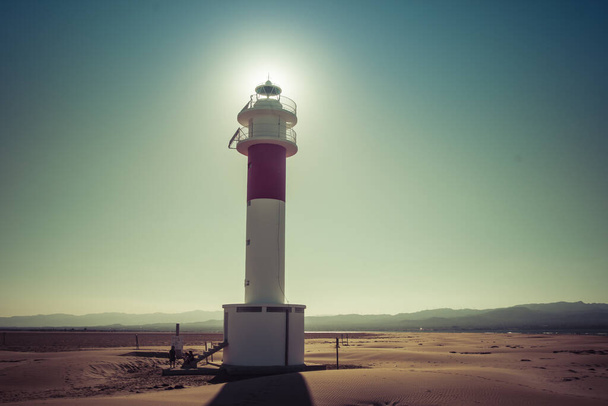 A historic old lighthouse in a deserted area on a beautiful sunny day - Foto, immagini