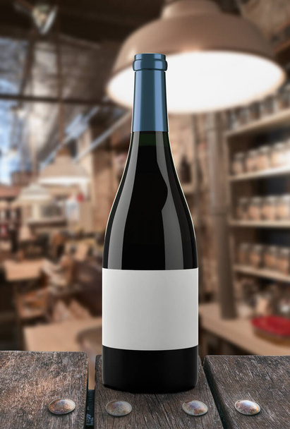 Bottle of red wine with a restaurant background - Foto, afbeelding