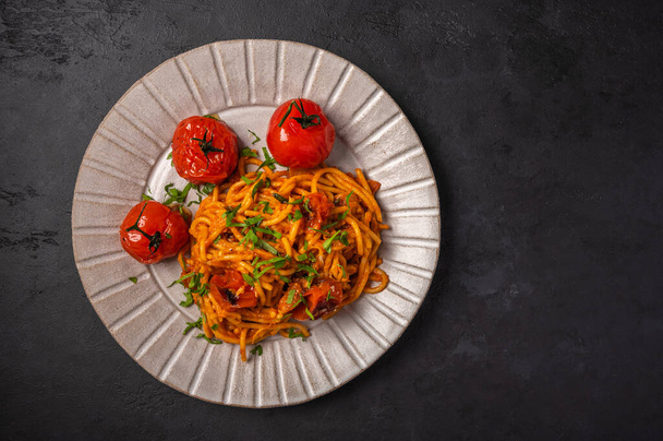 Pasta with baked cherry tomatoes, cheese and parsley - Photo, Image