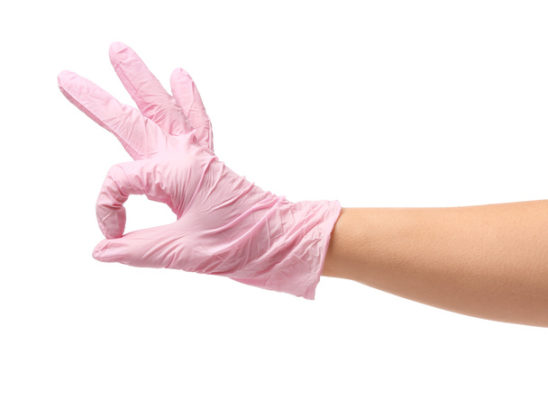 Hand in protective glove showing OK on white background - Valokuva, kuva