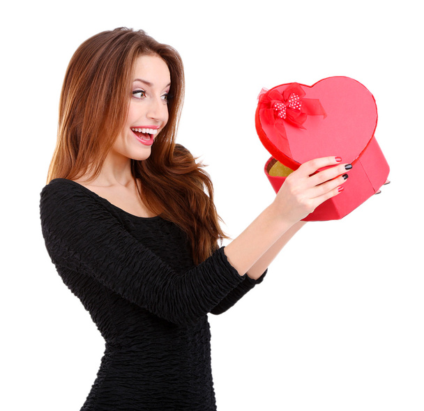 Attractive woman with gift box in form of heart, isolated on white - Foto, Bild