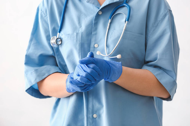 Female doctor wearing protective gloves, closeup - Photo, Image