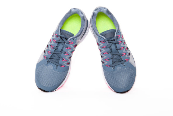 Pair of colored sport shoes on white background.  - Photo, Image