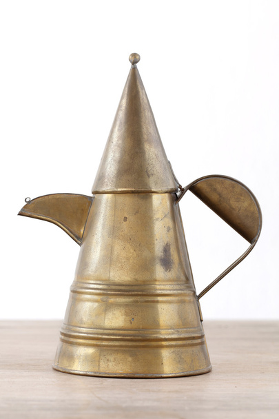 Antique luxury art brass tea pot on wooden table - Foto, imagen