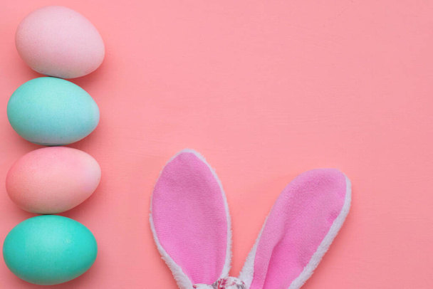Easter decor: pastel eggs and bunny ears. Preparing for Easter. - Фото, зображення