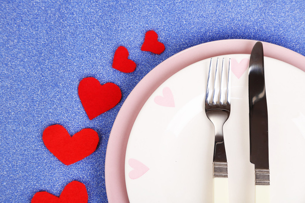Valentines day dinner with table setting on blue background - Fotoğraf, Görsel
