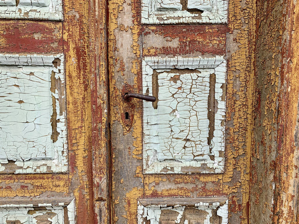 A closeup shot of an old weathered door - Fotoğraf, Görsel