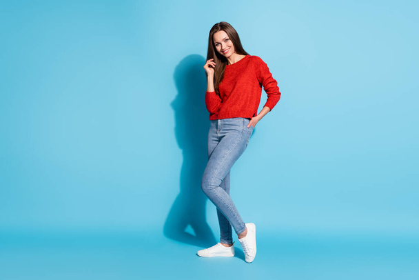 Full length photo of nice lovely girl touch hair wear pullover isolated over blue color background - Fotografie, Obrázek