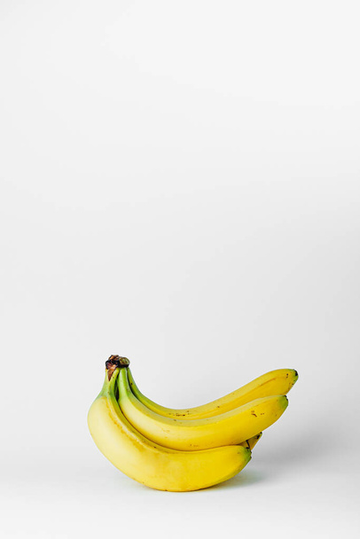 Bunch of bananas isolated. Peeled banana isolated on white background. bananas isolated on the white background.  - Zdjęcie, obraz
