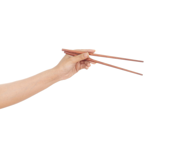 Chopsticks in a hand - Photo, image