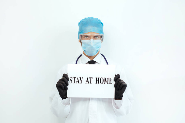 close up. doctor with a warning stay at home. - Foto, Imagen