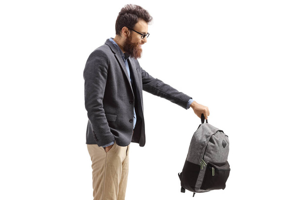 Bearded man holding a schoolbag isolated on white background - Zdjęcie, obraz