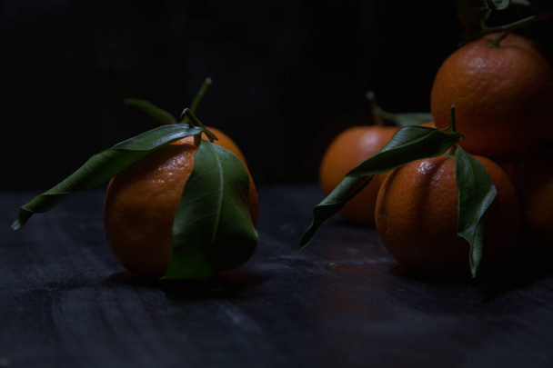 Tangerines on a black surface - Foto, Bild