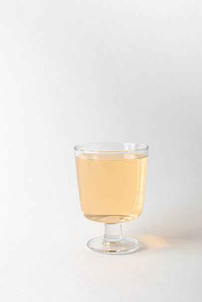 glass of juice on a white background - Фото, изображение