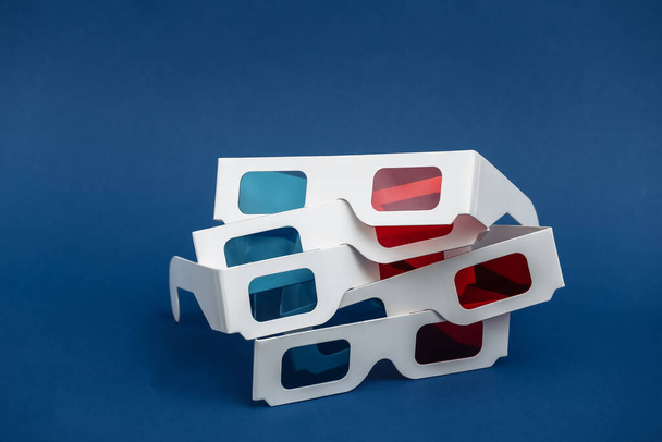 Anaglyph 3d glasses on classic blue background - Foto, Imagen