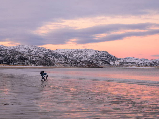 The photographer shoots a wonderful Arctic sunset landscape on the Arctic ocean. - Photo, Image
