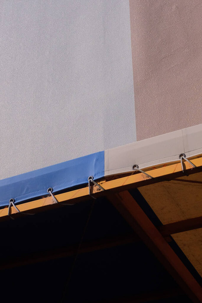 a vertical low angle shot of colorful soffits for roofing - Φωτογραφία, εικόνα