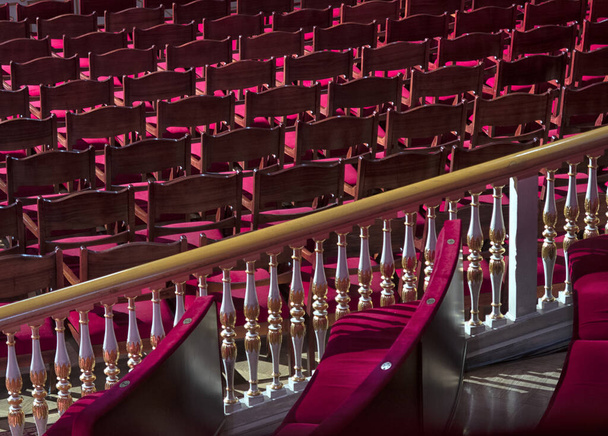 beautiful theater interior, soft armchairs in the auditorium, chandeliers in the foyer. - Foto, Imagem