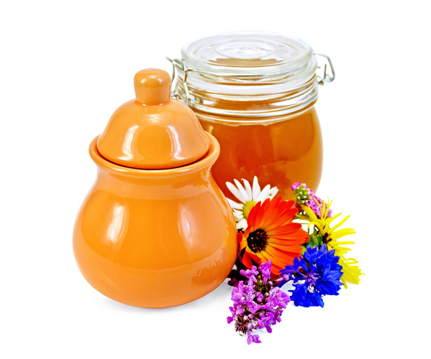 Honey in a jug and jar with flowers - Zdjęcie, obraz