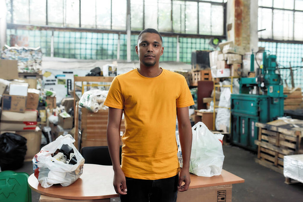 African american man standing on rubbish disposal station - Zdjęcie, obraz